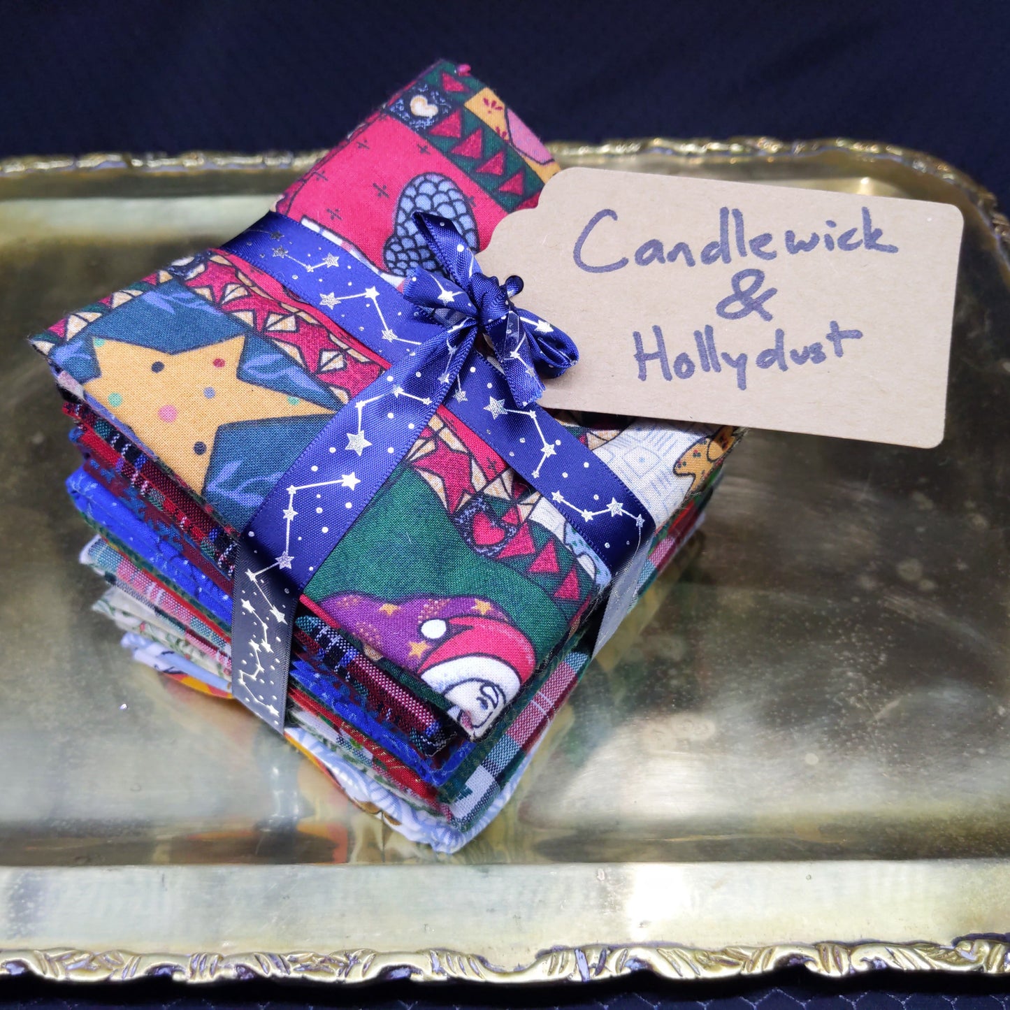 Colorful folded fabric with a name tag on a metallic surface